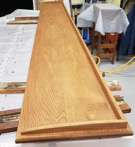 Oak bookshelf top with guard pieces installed