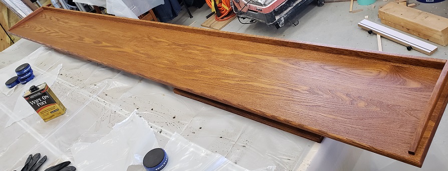 Oak bookshelf top with Minwax wipe on polyurethane applied