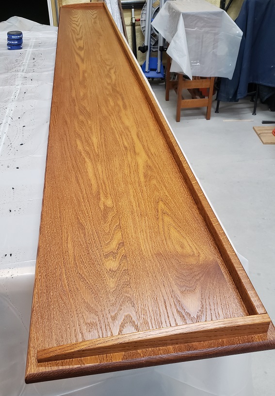 Oak bookshelf top with Minwax wipe on polyurethane applied