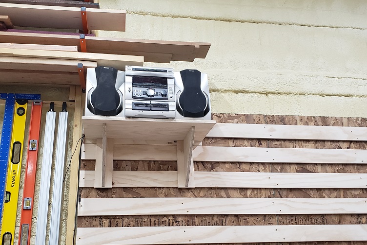 Sony bookshelf stereo sitting on shelf mounted to French cleat wall