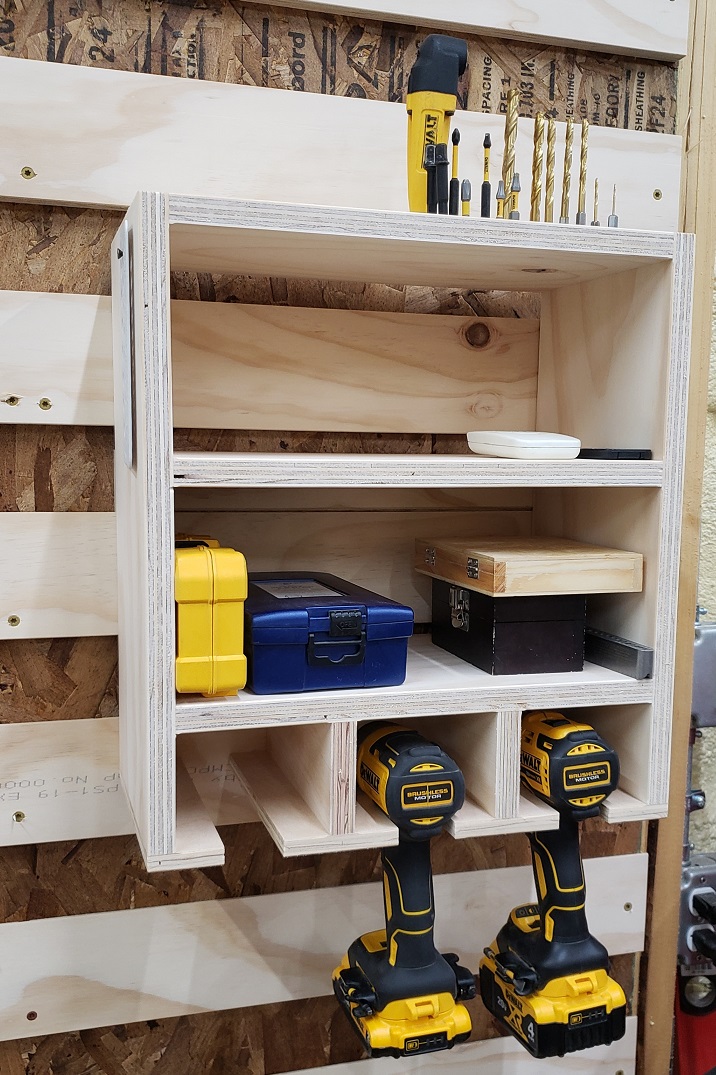French cleat wall module with shelves holding drill bits and Dewalt drill and impact driver