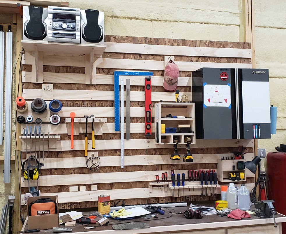 French cleat wall for woodworking shop behind workbench