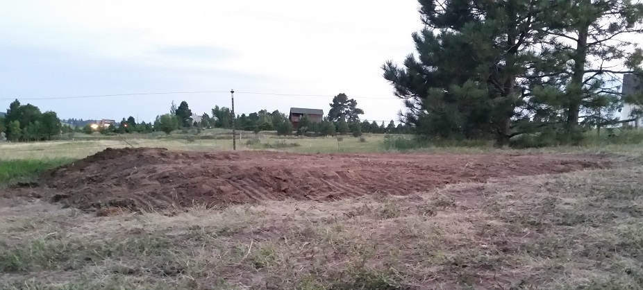 Leveled dirt pad in a pasture