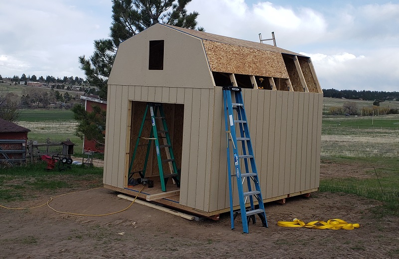 Sheeting installed on a gambrel style storage shed