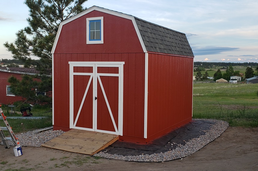 Red and white Heartland Gambrel storage shed