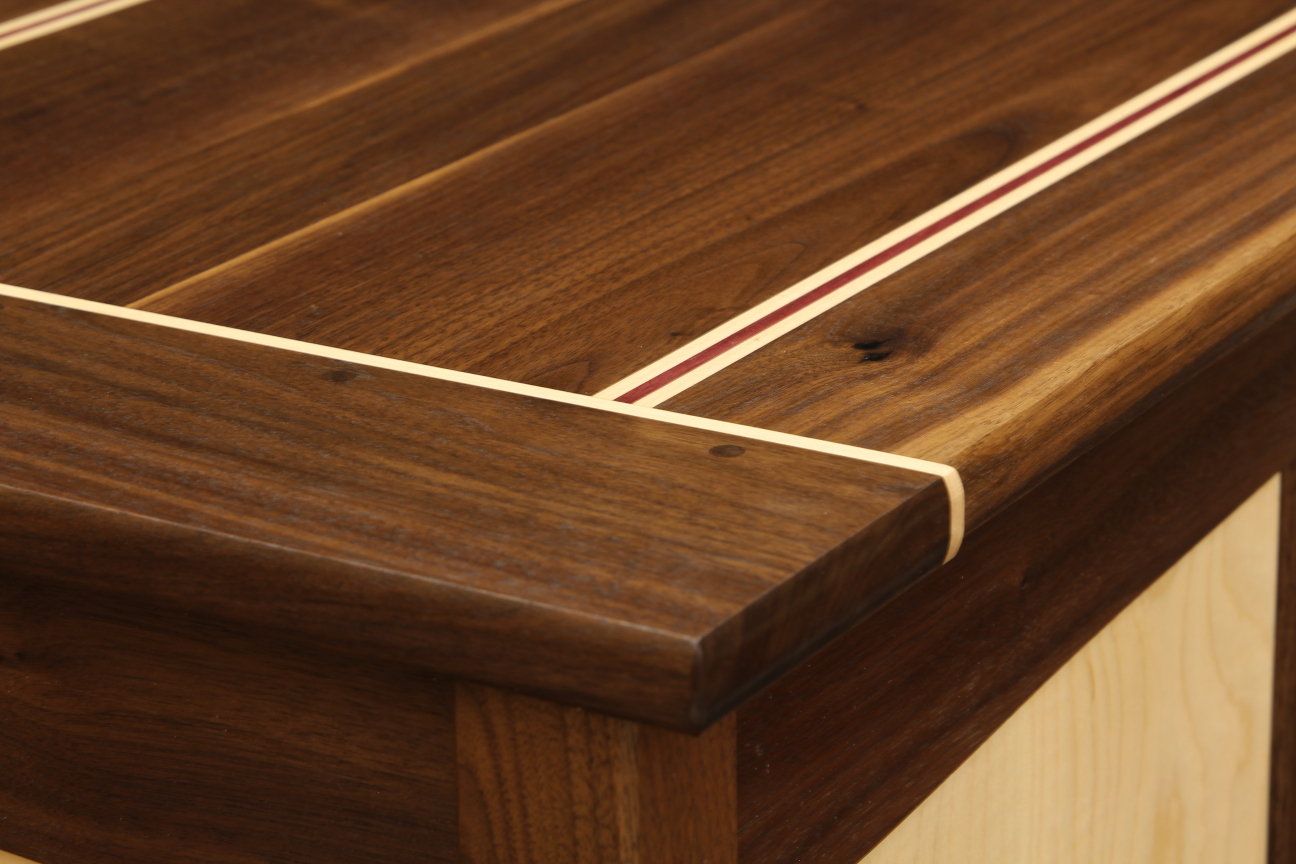Shaker style walnut and curly maple hope chest breadboard end with maple stripe