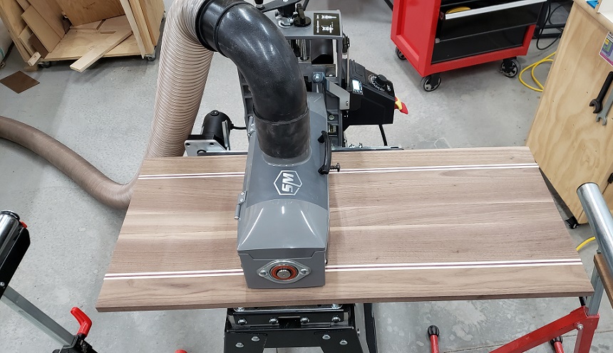 Sanding walnut and maple panel with Supermax 16-32 drum sander