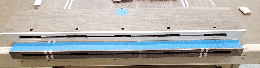 Floating tenon cuts for breadboard end in maple and walnut panel on workbench