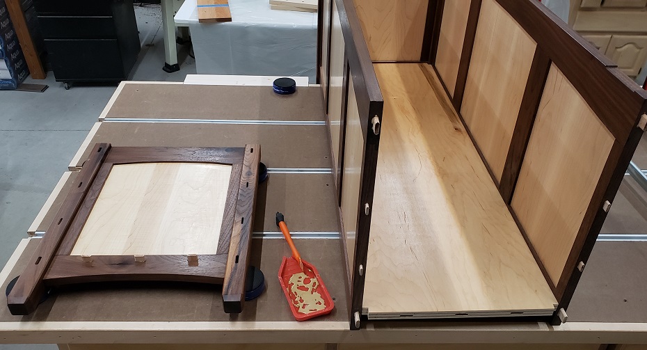 Assembling walnut and maple hope chest.