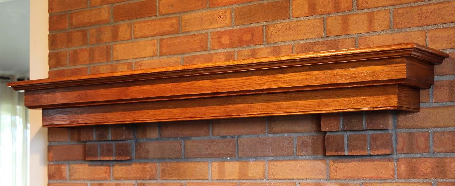 Oak fireplace mantel on brick corbels side view