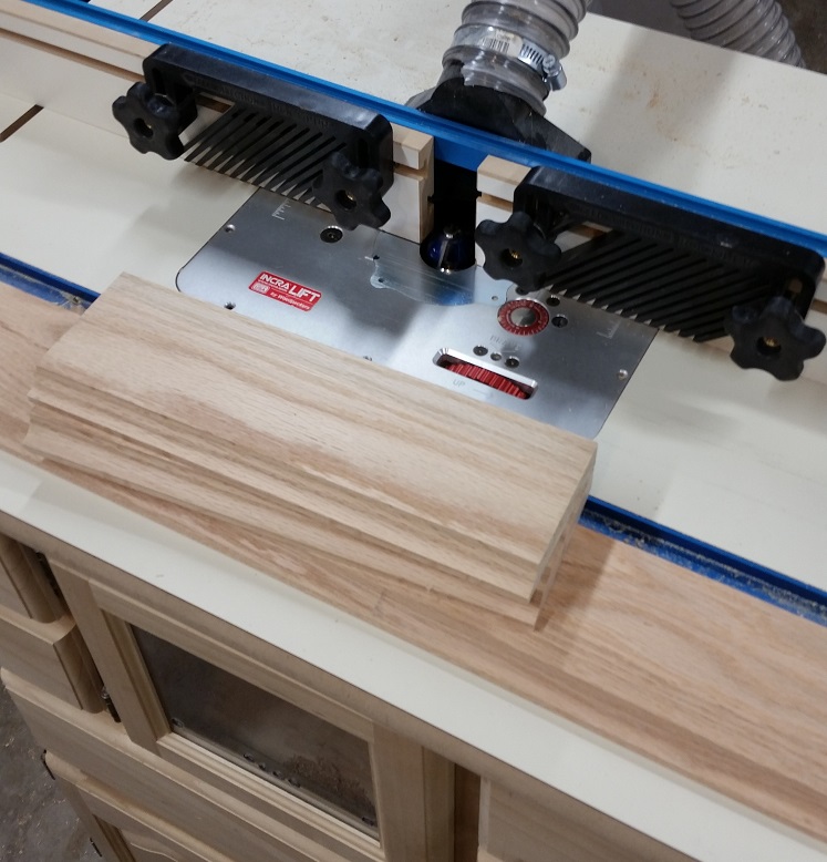 Oak boards sitting on Rockler router table top with Incra router lift