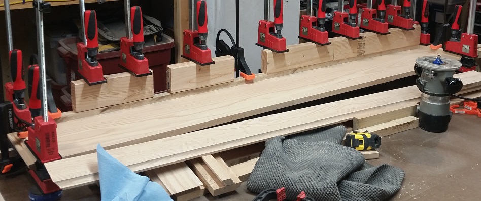 Oak fireplace mantel glue up clamped with Bessey Revo parallel clamps