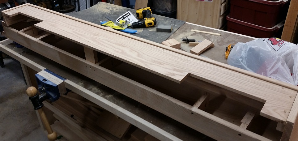 Removable panel for oak fireplace mantel on workbench