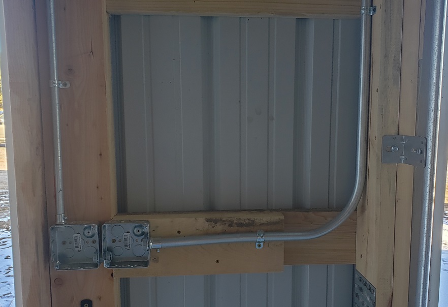EMT boxes mounted to pole barn purlin with conduit connected