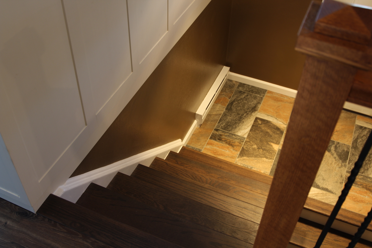 Oak stair retrotread dark finish with white stringer trim