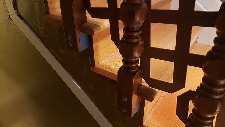 1970s stair ballusters attached to oak treads and risers