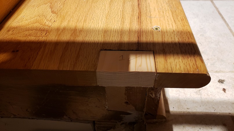 Filler block for notched out oak stair tread