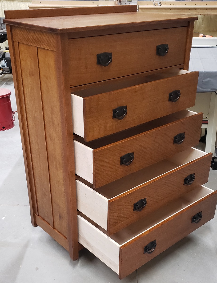 Five drawer mission style dresser of quartersawn red oak and maple drawer boxes with black handles