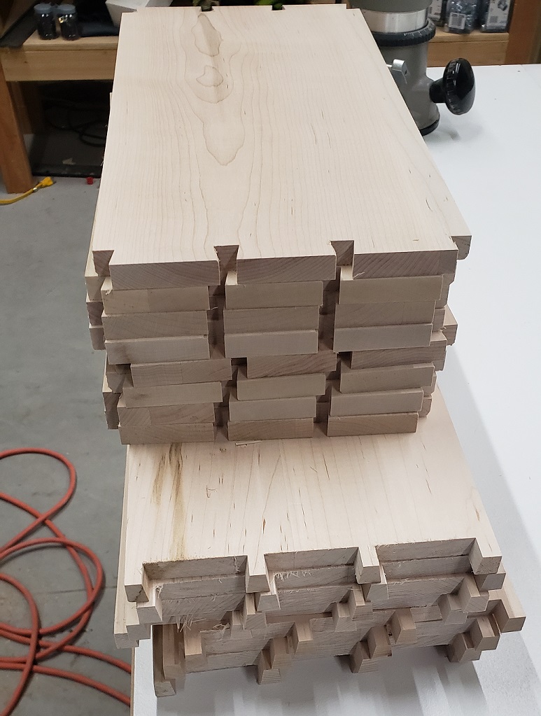 Stack of maple boards with dovetail pins and tails