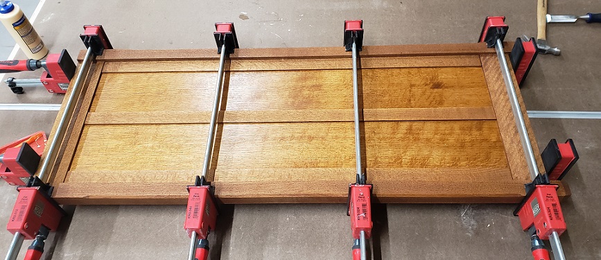 Bessey Revo clamps clamping a mission style panel