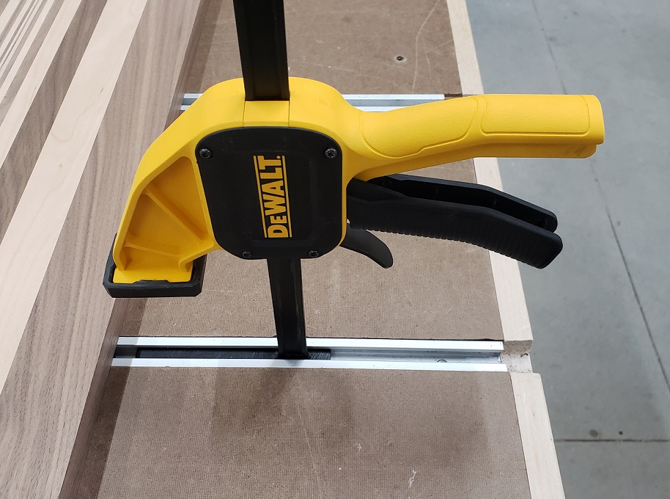 Modified DeWalt quick clamp in t-track on workbench
