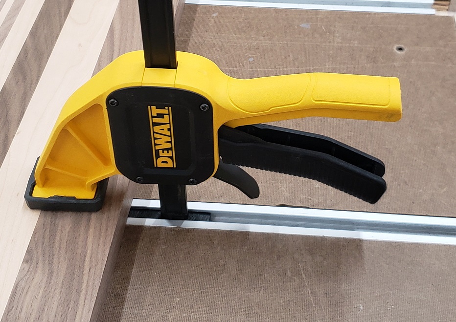 Modified DeWalt quick clamp in t-track on workbench