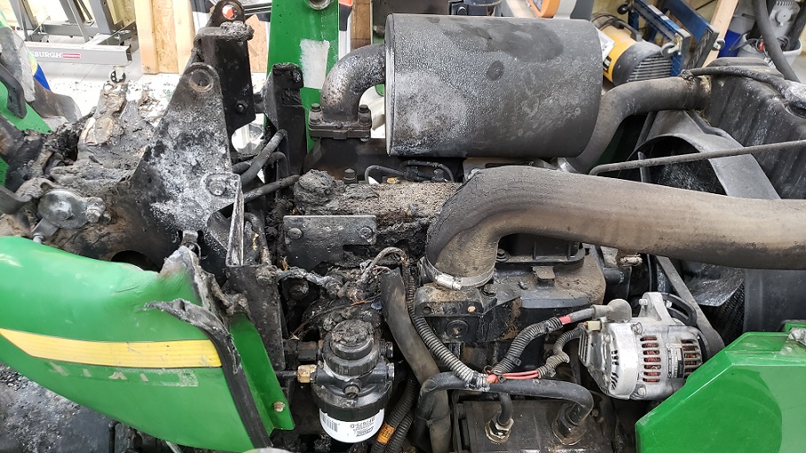Engine and operator console fire damage on a John Deere 5105 tractor