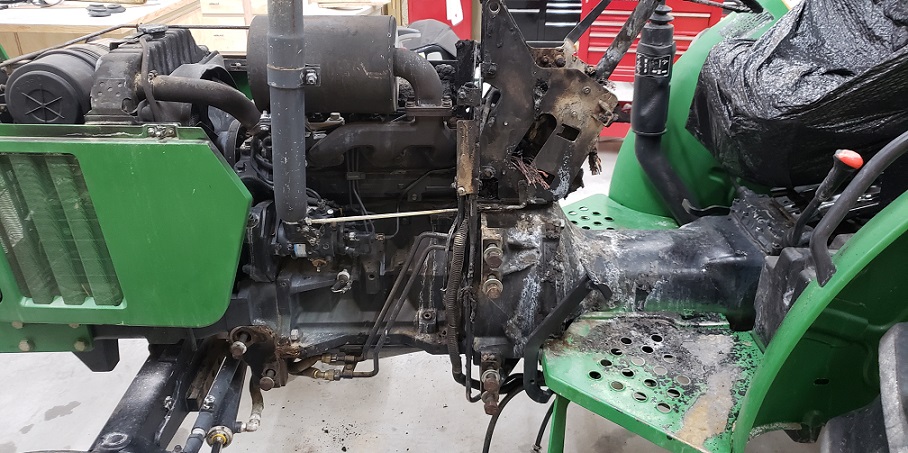 Engine and operator console fire damage on a John Deere 5105 tractor