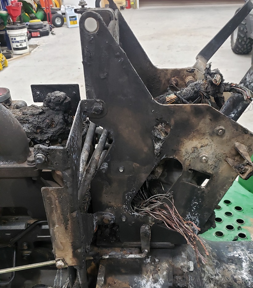 Operator console fire damage on a John Deere 5105 tractor