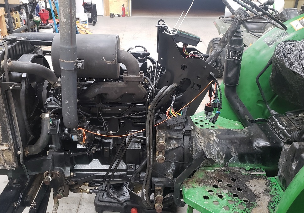 John Deere 5105 tractor partially repaired from fire damage