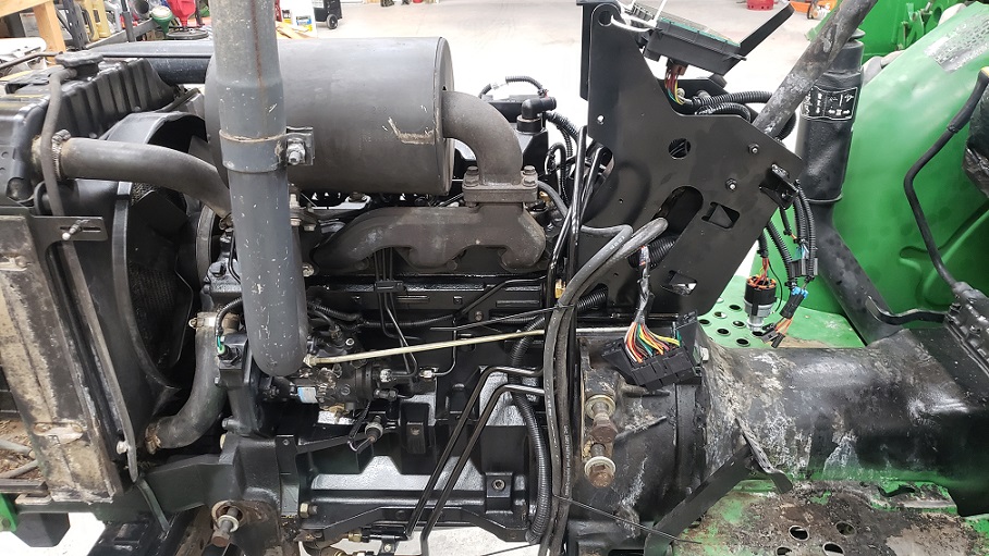 John Deere 5105 tractor partially repaired from fire damage