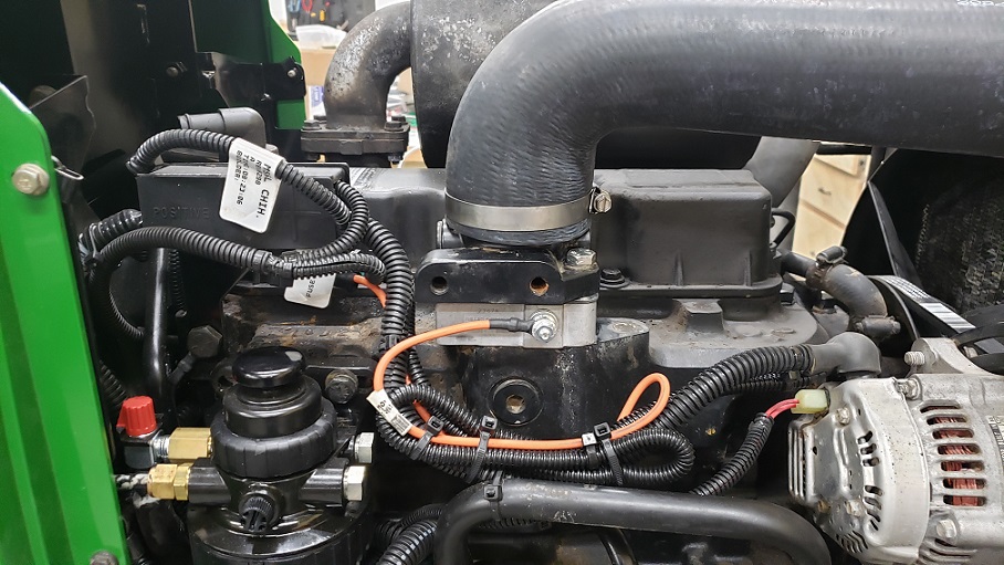 John Deere 2.9L engine in 5105 tractor with grid heater installed