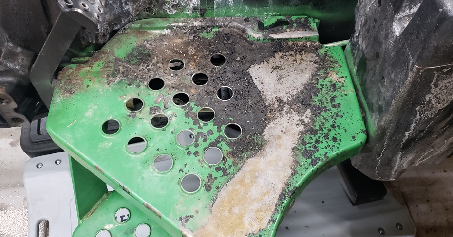 Operator platform with fire damage on John Deere 5105 tractor